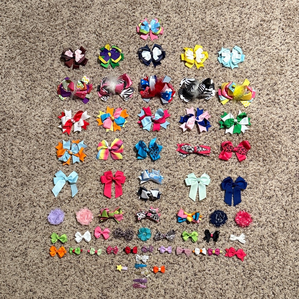 Girls bundle of bows and clips an assortment of sizes shapes and colors